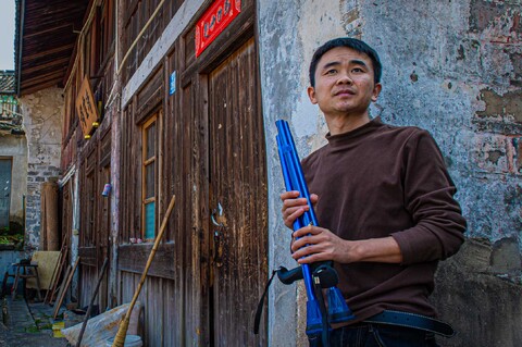 Portrait of Huang An, 'didi' cab driver, Ningbo China.