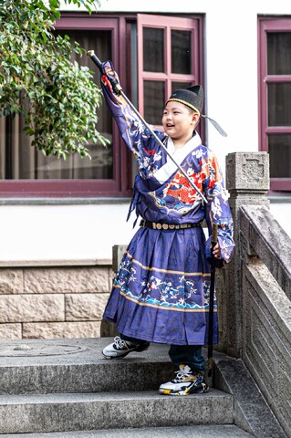 This little dude was having a load of fun waving an imitation sword around!
